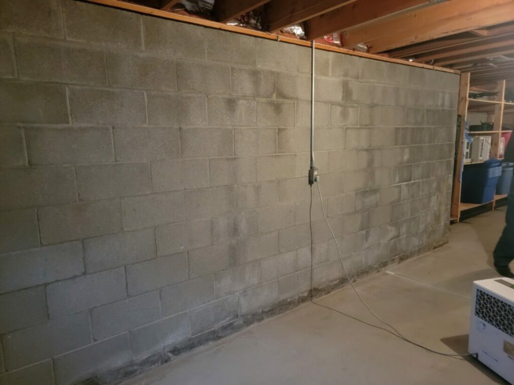 Interior basement wall waterproofed